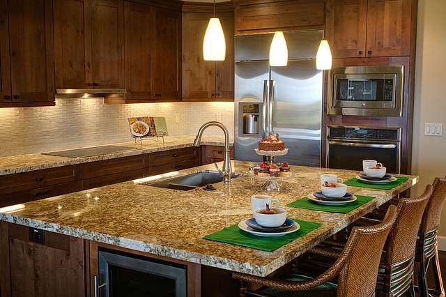 A kitchen island with storage spaces and an oven.