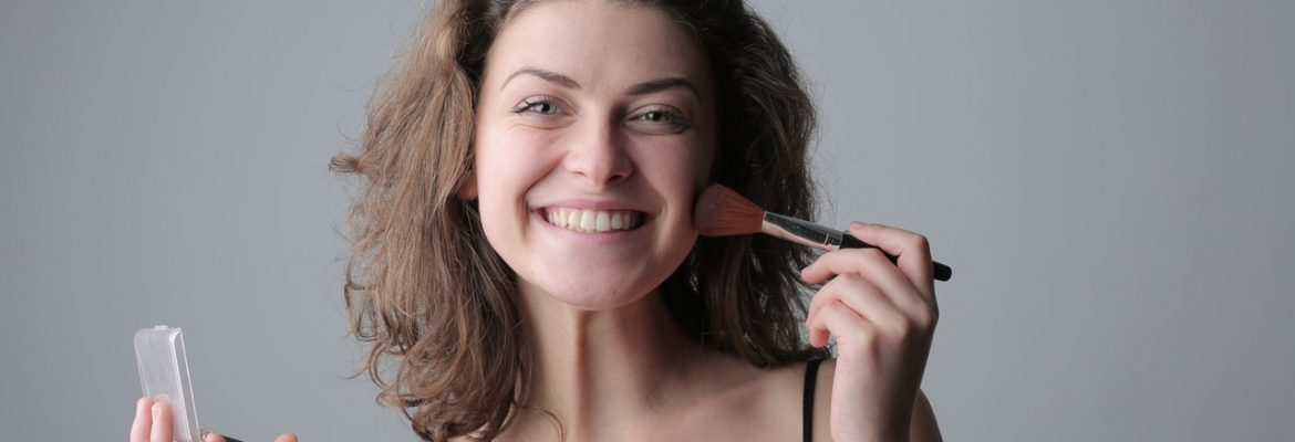 woman-in-black-spaghetti-strap-top-holding-makeup-3979134-1170x400