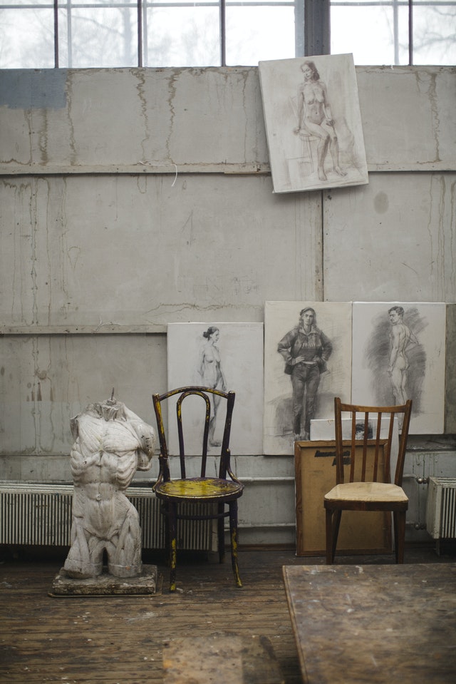 white-concrete-statue-near-brown-wooden-chairs-3778080 (1)