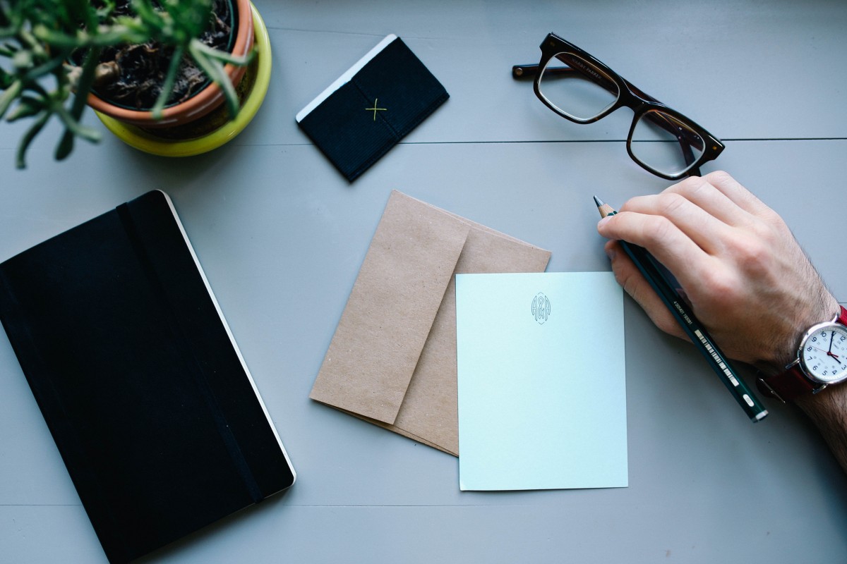 witing a letter of recommendation with envelope