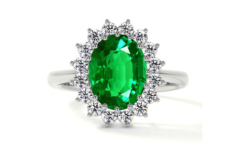 0.64 Carat Weight Natural Emerald Oval Halo Ring.