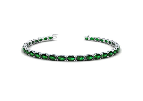 Luxurious GIA Certified 22.50cttw Oval Shape Emerald Tennis Bracelet.