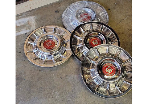 1957 cadillac hubcaps fresh out of the polisher